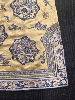 Lot 395 - A fine Chinese yellow-ground embroidered silk robe, Qing dynasty, 19th Century