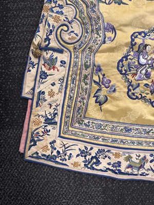 Lot 395 - A fine Chinese yellow-ground embroidered silk robe, Qing dynasty, 19th Century