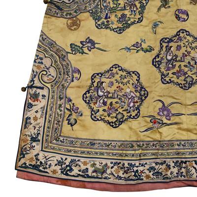 Lot 395 - A fine Chinese yellow-ground embroidered silk robe, Qing dynasty, 19th Century