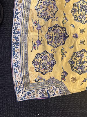 Lot 395 - A fine Chinese yellow-ground embroidered silk robe, Qing dynasty, 19th Century