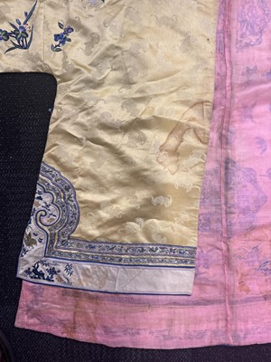Lot 395 - A fine Chinese yellow-ground embroidered silk robe, Qing dynasty, 19th Century