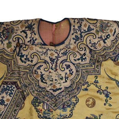 Lot 395 - A fine Chinese yellow-ground embroidered silk robe, Qing dynasty, 19th Century