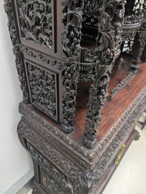 Lot 130 - A fine Chinese export carved and pierced hardwood (hongmu) display cabinet, late 19th century