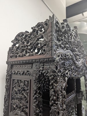 Lot 130 - A fine Chinese export carved and pierced hardwood (hongmu) display cabinet, late 19th century