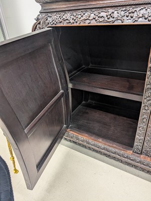 Lot 130 - A fine Chinese export carved and pierced hardwood (hongmu) display cabinet, late 19th century