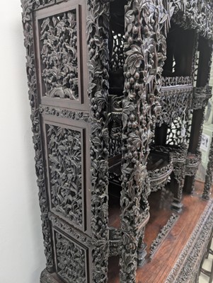 Lot 130 - A fine Chinese export carved and pierced hardwood (hongmu) display cabinet, late 19th century