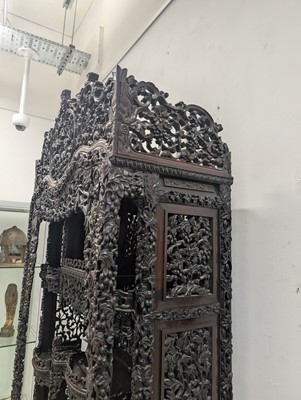 Lot 130 - A fine Chinese export carved and pierced hardwood (hongmu) display cabinet, late 19th century