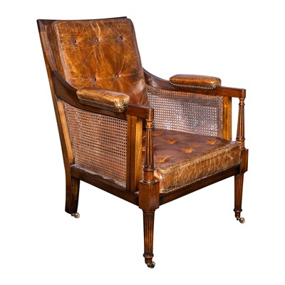 Lot 111 - A Regency style mahogany bergère library armchair