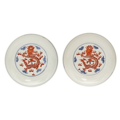 Lot 487 - A pair of Chinese blue and white and iron-red 'dragon' dishes, 19th - 20th century