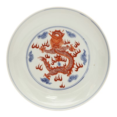 Lot 487 - A pair of Chinese blue and white and iron-red 'dragon' dishes, 19th - 20th century