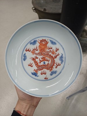 Lot 487 - A pair of Chinese blue and white and iron-red 'dragon' dishes, 19th - 20th century