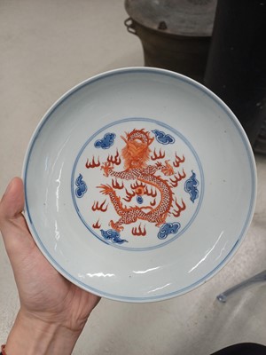 Lot 487 - A pair of Chinese blue and white and iron-red 'dragon' dishes, 19th - 20th century