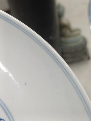 Lot 487 - A pair of Chinese blue and white and iron-red 'dragon' dishes, 19th - 20th century