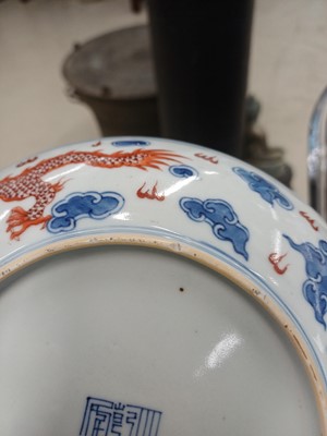 Lot 487 - A pair of Chinese blue and white and iron-red 'dragon' dishes, 19th - 20th century