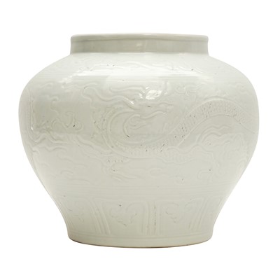 Lot 129 - A large Chinese white-glazed 'dragon' jar, Ming dynasty