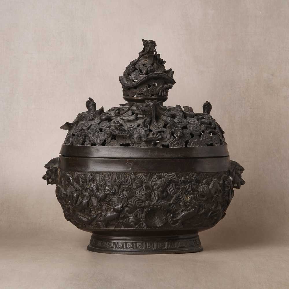 Lot 77 - A large Chinese bronze reticulated 'dragon and phoenix' censer, 17th century