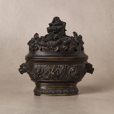 Lot 74 - A fine Chinese bronze parcel-gilt 'dragon and phoenix' censer and cover, 17th century