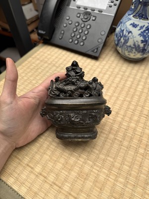 Lot 74 - A fine Chinese bronze parcel-gilt 'dragon and phoenix' censer and cover, 17th century