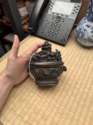 Lot 74 - A fine Chinese bronze parcel-gilt 'dragon and phoenix' censer and cover, 17th century