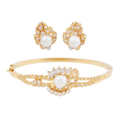 Lot 402 - A pearl and diamond bangle and earrings suite