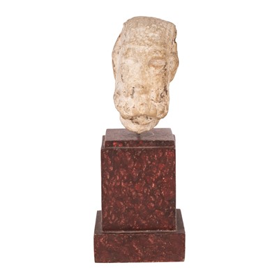 Lot 74 - A worn marble head of a bearded male, possibly Roman
