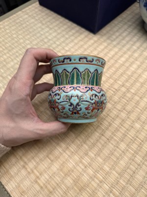 Lot 69 - A Chinese famille-rose 'lotus' leys jar, zhadou, Qing dynasty, 18th/19th century