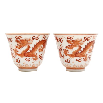 Lot 345 - A pair of Chinese iron-red 'dragon' wine cups, Republic period, Guangxu marks