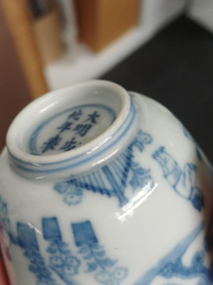 Lot 77 - A Chinese blue and white 'figural' cup, Qing Dynasty, 18th century