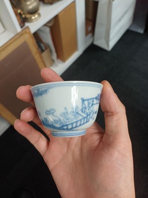 Lot 77 - A Chinese blue and white 'figural' cup, Qing Dynasty, 18th century