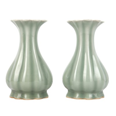 Lot 657 - A pair of Chinese celadon-glazed lobed vases, 20th century