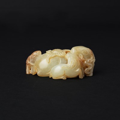Lot 147 - A Chinese celadon jade 'rams' group, 18th/19th century