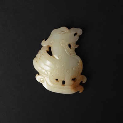 Lot 115 - A Chinese white jade 'mythical beast' plaque, Qing dynasty, 18th/19th century