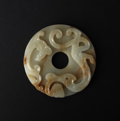 Lot 153 - A Chinese archaistic white jade 'chilong' round plaque, Qing dynasty, 18th/19th century