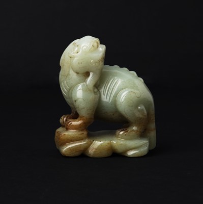 Lot 114 - A Chinese celadon jade 'mythical beast' group, Qing dynasty, 18th/19th century