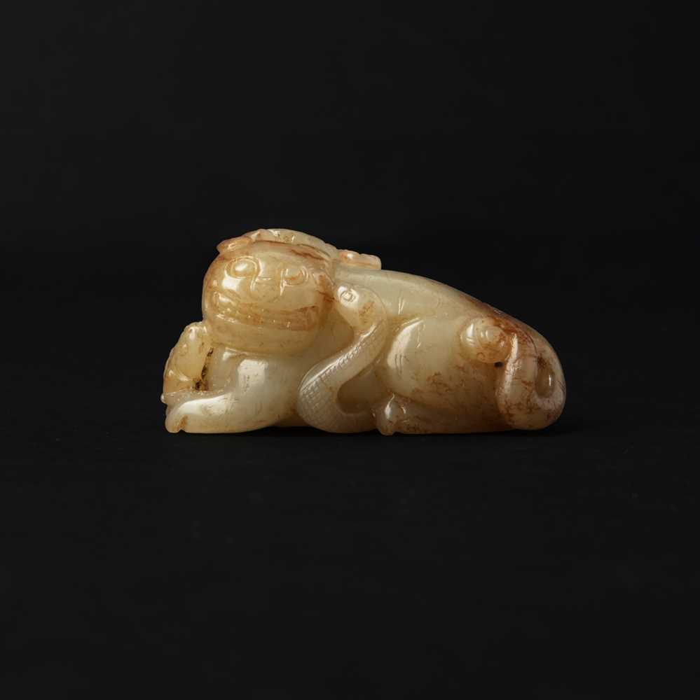 Lot 84 - A Chinese jade 'mythical beast' group, 19th / 20th century