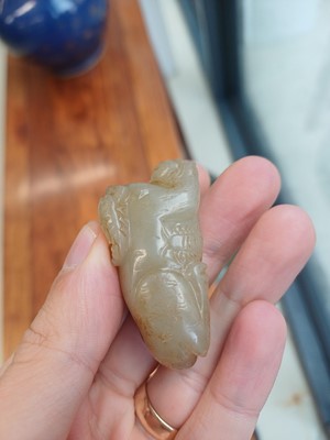 Lot 84 - A Chinese jade 'mythical beast' group, 19th / 20th century