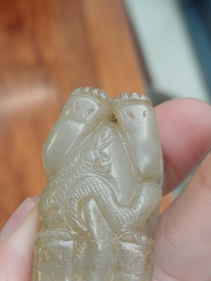 Lot 84 - A Chinese jade 'mythical beast' group, 19th / 20th century