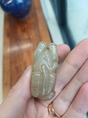 Lot 84 - A Chinese jade 'mythical beast' group, 19th / 20th century