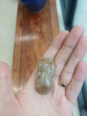 Lot 84 - A Chinese jade 'mythical beast' group, 19th / 20th century