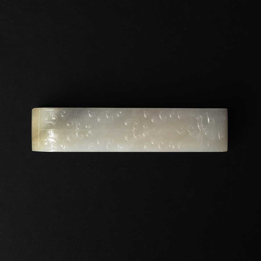 Lot 91 - A Chinese archaistic white jade 'taotie' belt hook, Qing dynasty, 18th/19th century