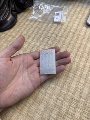 Lot 92 - A Chinese white jade 'figurative' pendant plaque, Qing dynasty, 18th/19th century