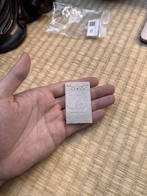 Lot 92 - A Chinese white jade 'figurative' pendant plaque, Qing dynasty, 18th/19th century