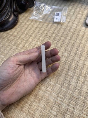 Lot 92 - A Chinese white jade 'figurative' pendant plaque, Qing dynasty, 18th/19th century