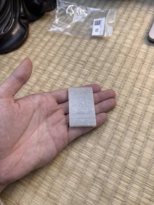 Lot 92 - A Chinese white jade 'figurative' pendant plaque, Qing dynasty, 18th/19th century