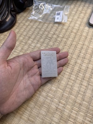 Lot 92 - A Chinese white jade 'figurative' pendant plaque, Qing dynasty, 18th/19th century