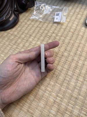 Lot 92 - A Chinese white jade 'figurative' pendant plaque, Qing dynasty, 18th/19th century