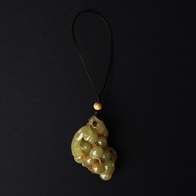 Lot 580 - A Chinese jade 'squirrel and grape' group, 20th century