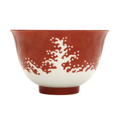 Lot 351 - A Chinese coral-glazed reverse-decorated 'wave' bowl, 20th century, Chenghua mark