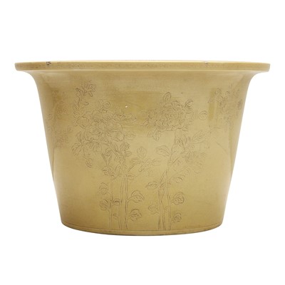 Lot 284 - A Chinese monochrome yellow-ground incised jardiniere, Qing dynasty, Tihedian zhi mark