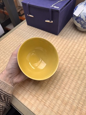 Lot 62 - A Chinese green-enamelled yellow-ground 'dragon' bowl, Qianlong mark and possibly of the period